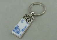 1.5 Inch Zinc Alloy Advertising Keychains With Porcelain Piece Inserted