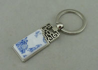 1.5 Inch Zinc Alloy Advertising Keychains With Porcelain Piece Inserted